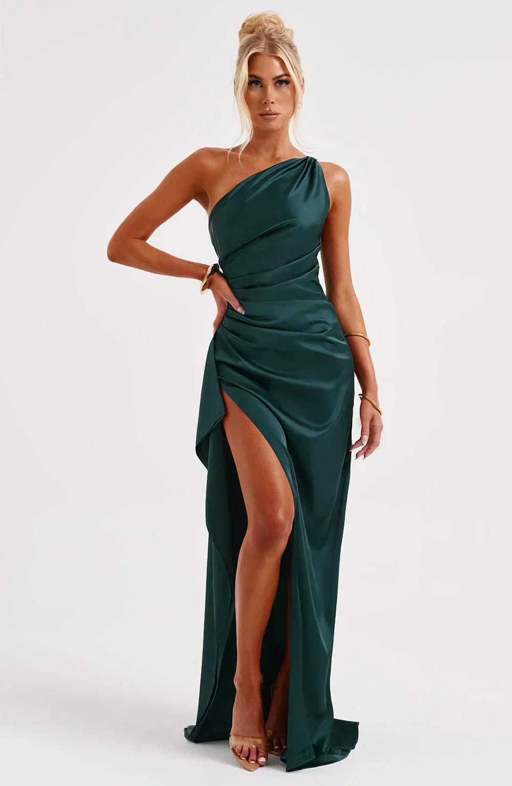 Dynamic shot of the white one-shoulder draped maxi dress, showcasing its movement and elegant design for women.