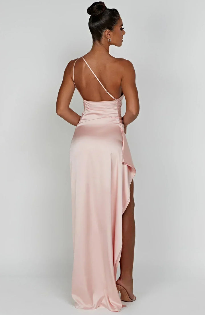 Fashionable white one-shoulder maxi dress for women, featuring a draped design, perfect for elegant summer events.