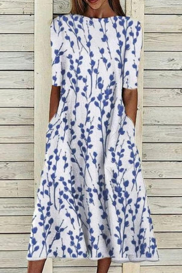 Elegant women's white & blue botanical print midi dress with half sleeves & crew neck, perfect for summer casual wear.