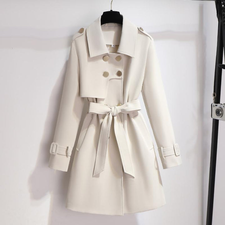 Elegant women's white classic lapel belted trench coat, perfect for stylish outerwear fashion.