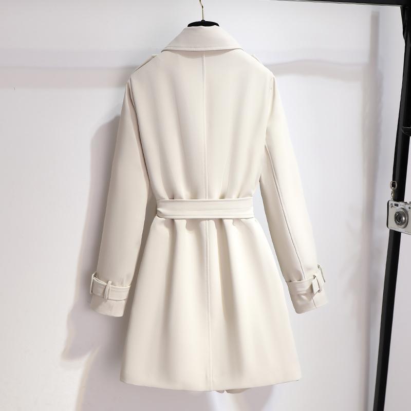 Classic white trench coat for women with a belted waist and sophisticated lapel design, an elegant outerwear piece.