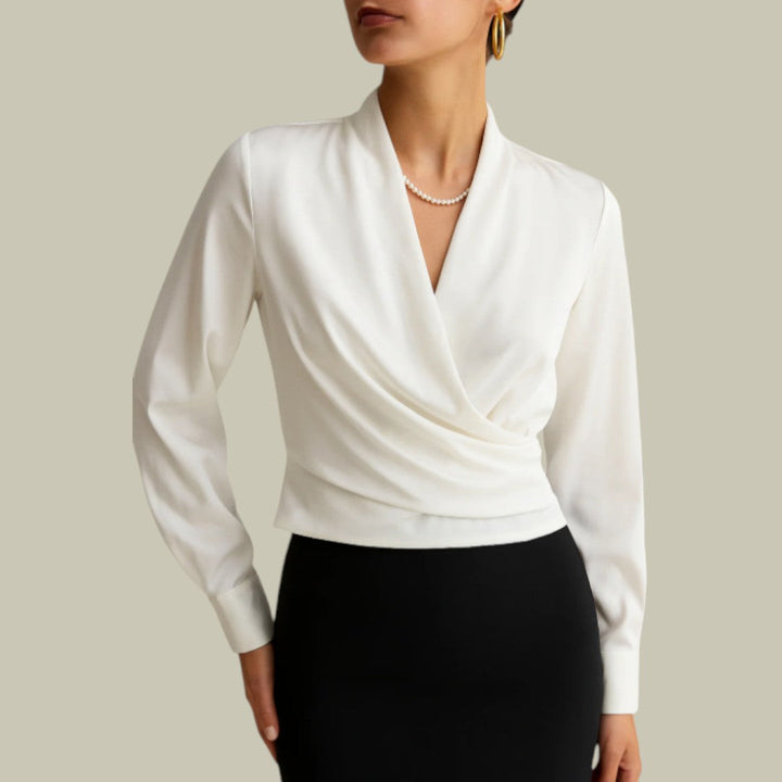 Soft peach satin long-sleeve blouse for women, featuring an elegant wrap front design for a chic look