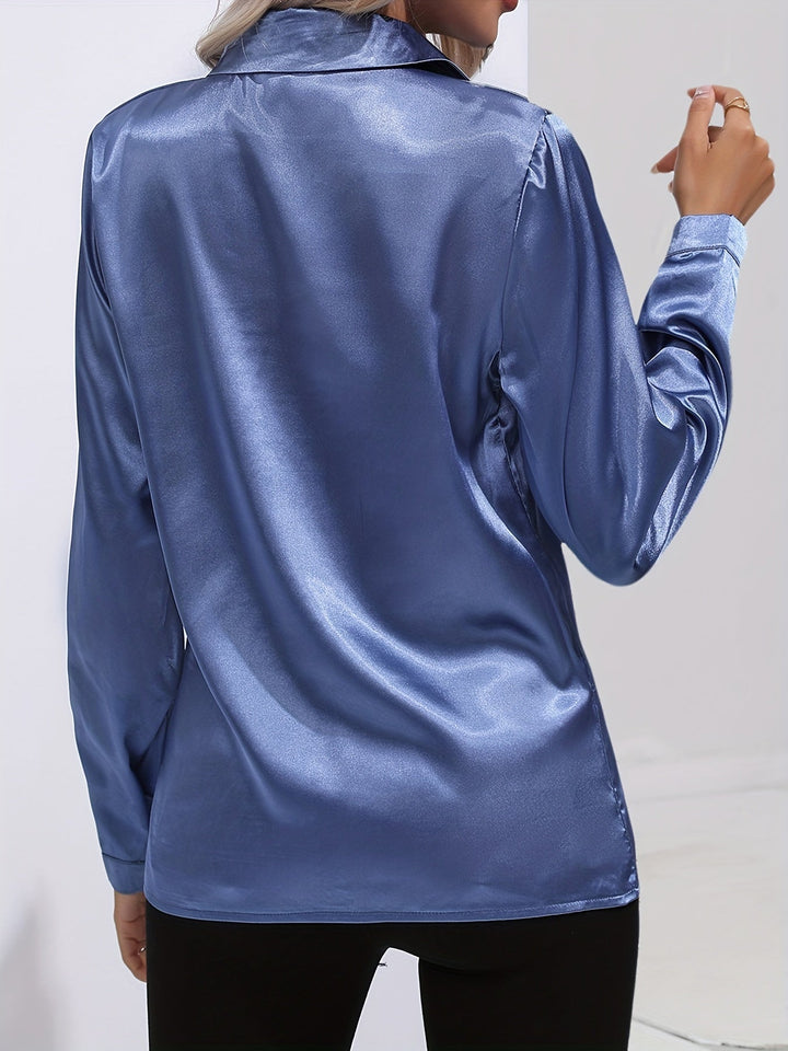 Luxurious red satin button down blouse for women, featuring long sleeves and an elegant drape.