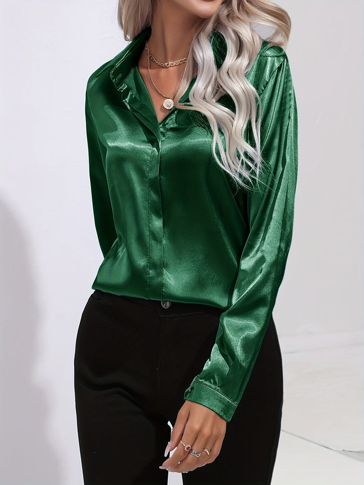 Stylish women's emerald green satin blouse with long sleeves and classic button down front.