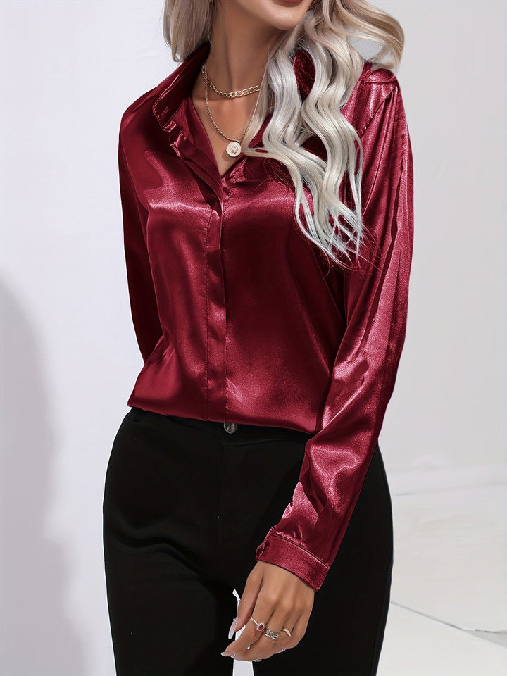 Chic navy blue satin long sleeve blouse, button down style, ideal for a sophisticated women's look.