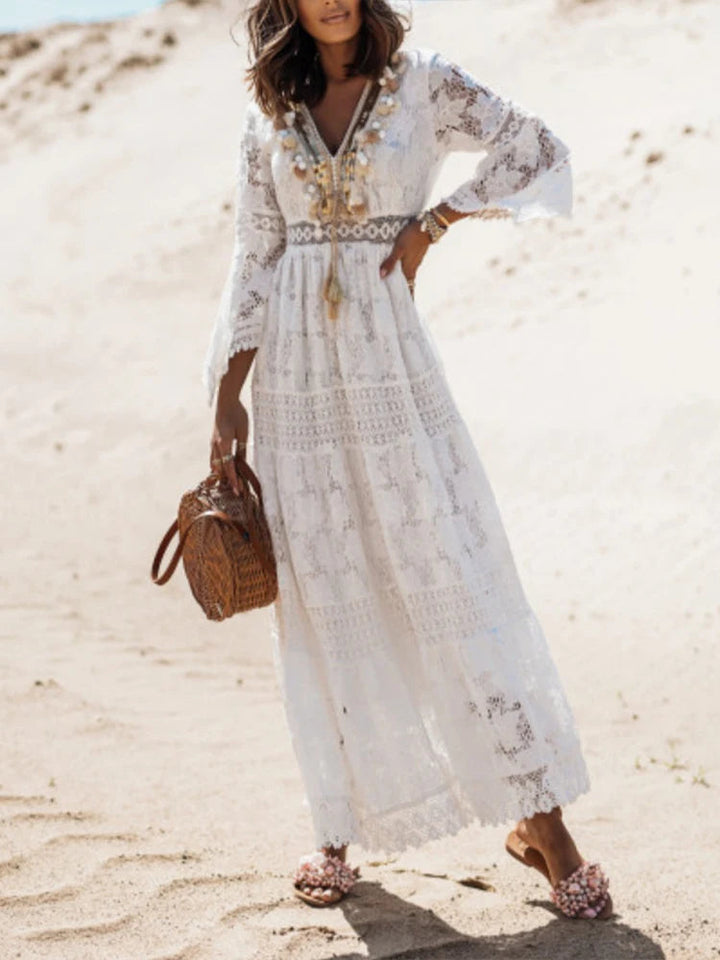 Elegant women's white V-neck tiered maxi dress with long sleeves, perfect for versatile fashion.