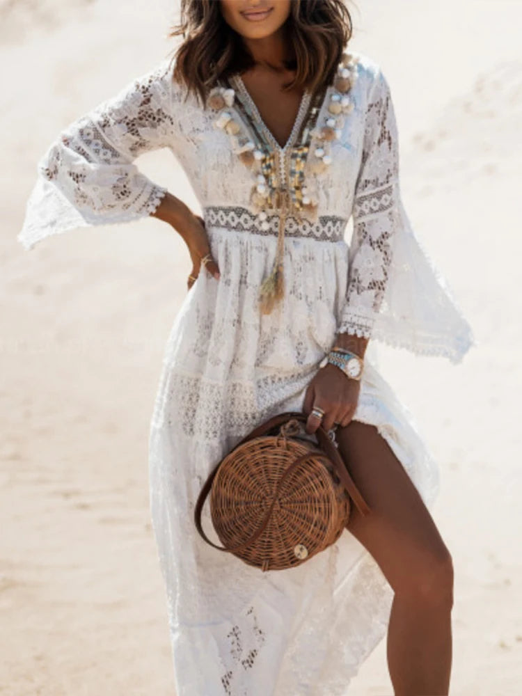 Feminine V-neck tiered white maxi dress for women, ideal for special occasions or casual chic elegance.