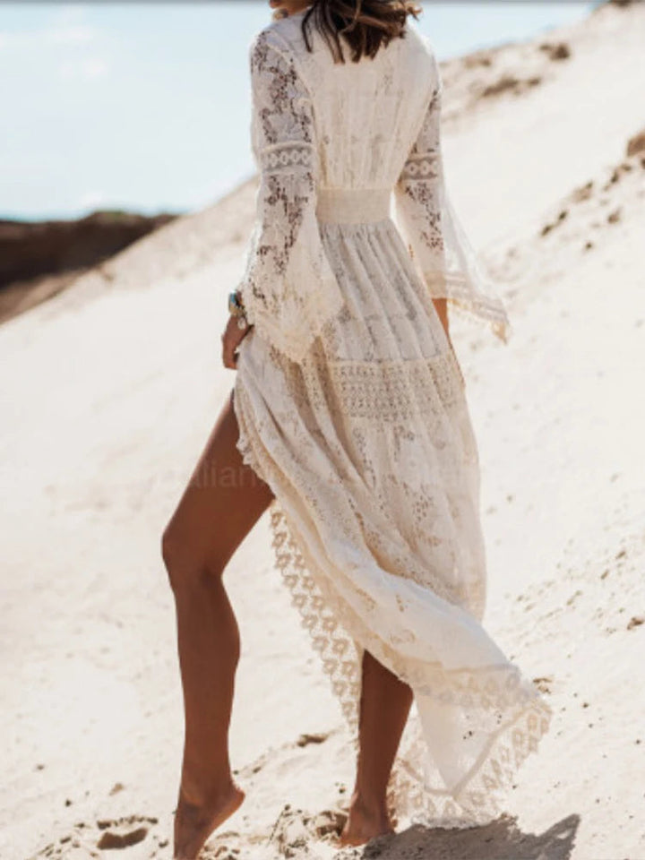 Beautiful white V-neck tiered maxi dress, long sleeve, designed for a sophisticated and feminine look.