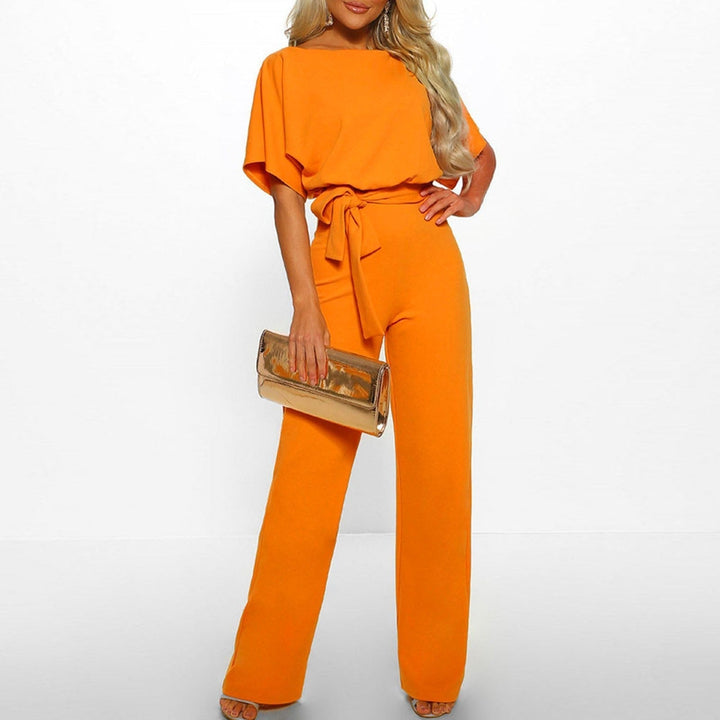 Back view of a women's elegant wide leg belted jumpsuit. Comfortable one-piece, perfect for versatile spring/summer fashion.