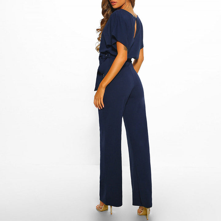 Front detail: women's elegant wide leg belted jumpsuit with boat neck and belt. Emphasizes fashion for spring/summer.