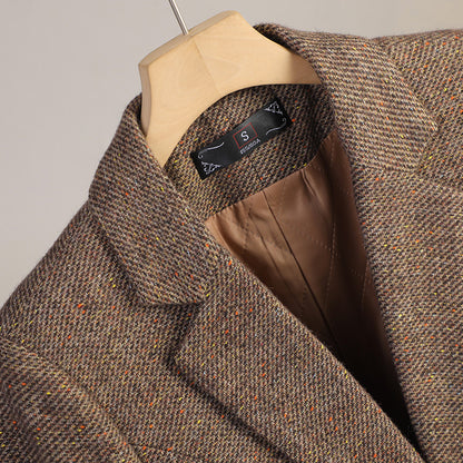 Chic women's tweed blazer jacket in a sophisticated wool blend, ideal for elegant and professional wear