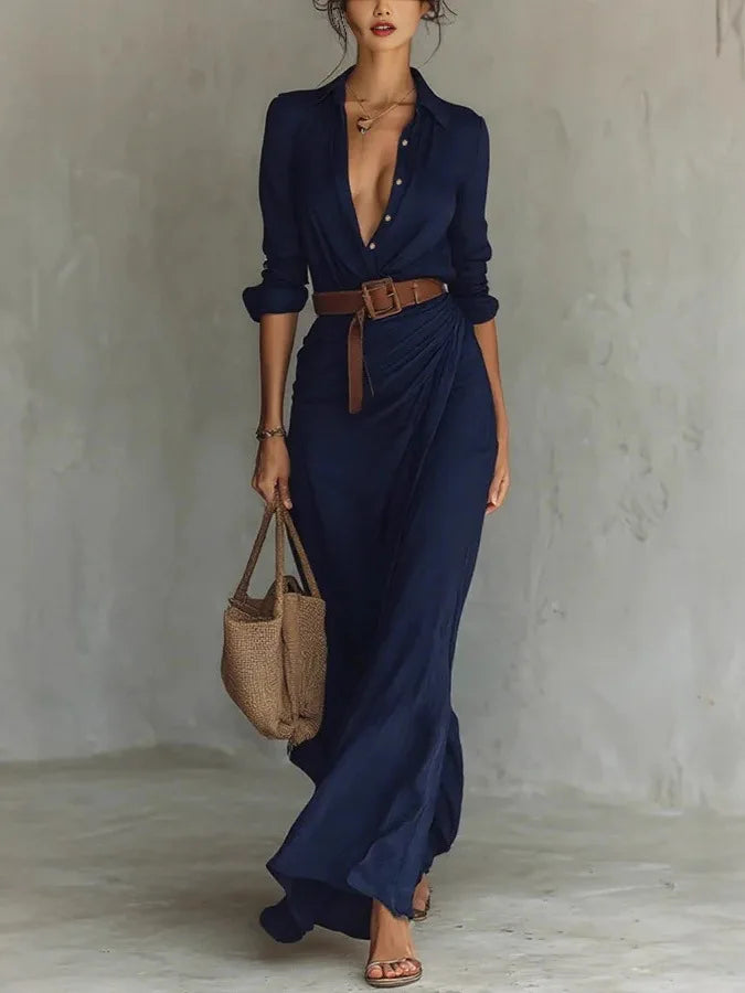 Sophisticated women's long sleeve V-neck wrap maxi dress. Features an elegant flowy silhouette and adjustable waist.