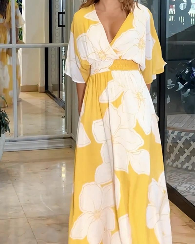 Flowy women's floral print maxi dress with flutter sleeves, V-neck. Ideal for garden parties & elegant summer events.