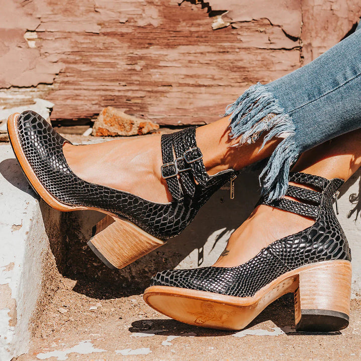 "Elegant women's block heel ankle boots in black, with round toe and back zipper, perfect for chic and comfortable wear."