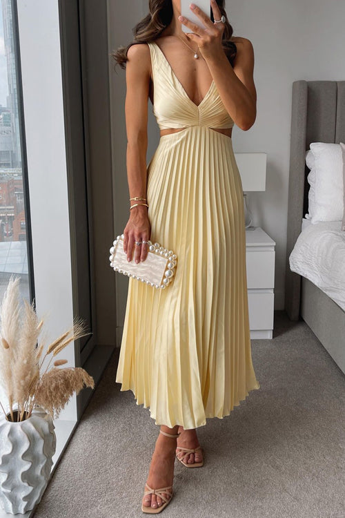 Elegant women's maxi dress with v-neck, cut-out waist, and pleated skirt, showcasing flowing sophistication and silhouette ac
