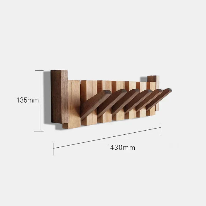 Modern wooden piano key coat rack for entryway. Decorative wall organizer with wood finish.