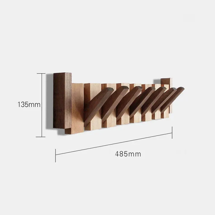 Elegant wooden piano key coat rack. Space-saving wall storage for modern hallway organization.