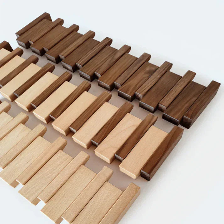 Functional wooden piano key coat rack. Modern home decor for hallway organization, folding hooks.
