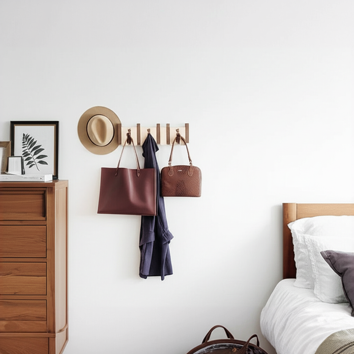 Wooden piano key coat rack with folding hooks. Modern wall storage for entryway and hallway.