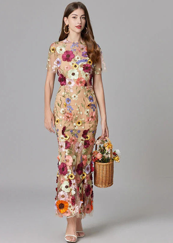Stunning beige mermaid maxi dress, featuring delicate 3D floral details and a sheer elegant design.