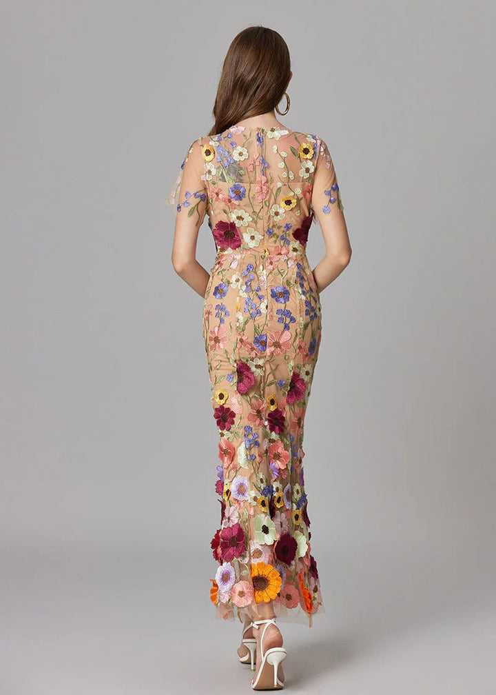 Chic formal evening gown in dark pink, a mermaid style with delicate sheer sections & 3D florals.