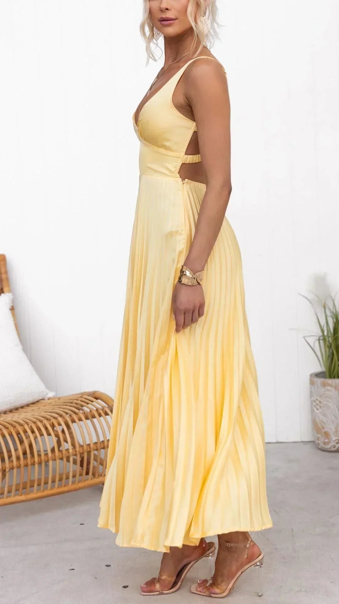 Stylish women's V-neck pleated maxi dress in a vibrant yellow, perfect for any occasion