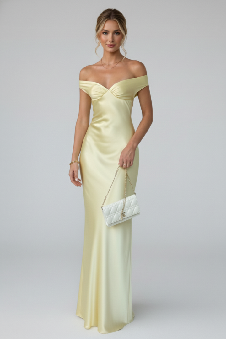 Chic women's off-shoulder maxi dress, elegant long evening wear with a fitted bodice & flowing skirt. Versatile fashion.