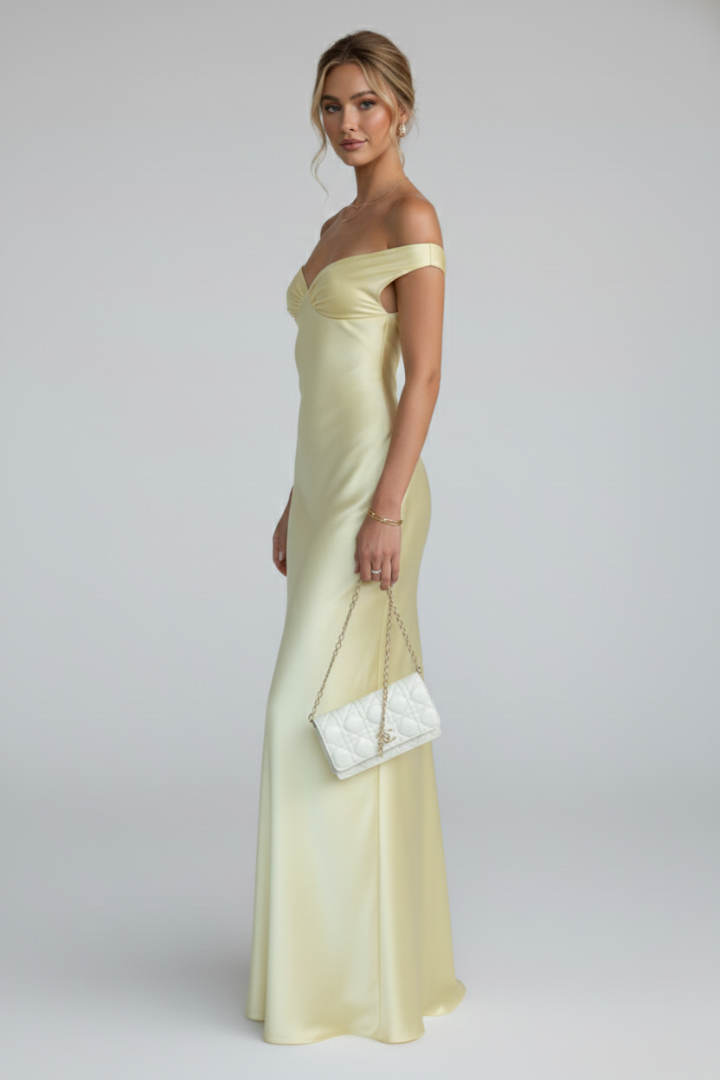 Stylish yellow off-shoulder maxi dress for women, elegant long party dress with fitted top and graceful flowing skirt.