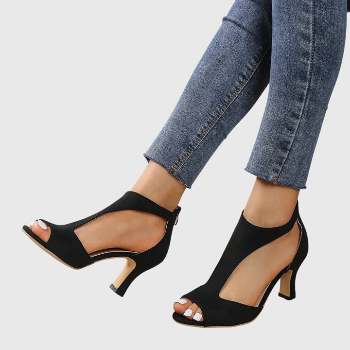 Black Elizabeth open-toe cutout heel, chic summer footwear by Ash New York.