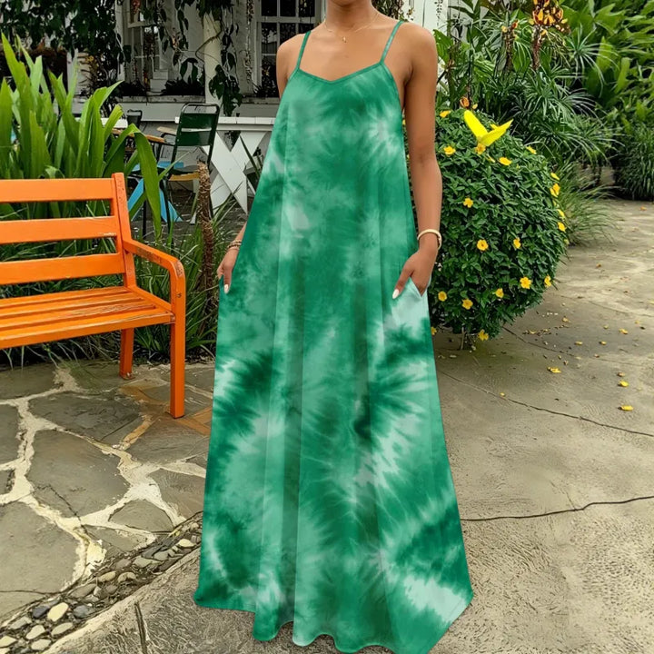 Women's flowing tie-dye maxi dress, strappy and sleeveless, great for casual summer or beach outings.