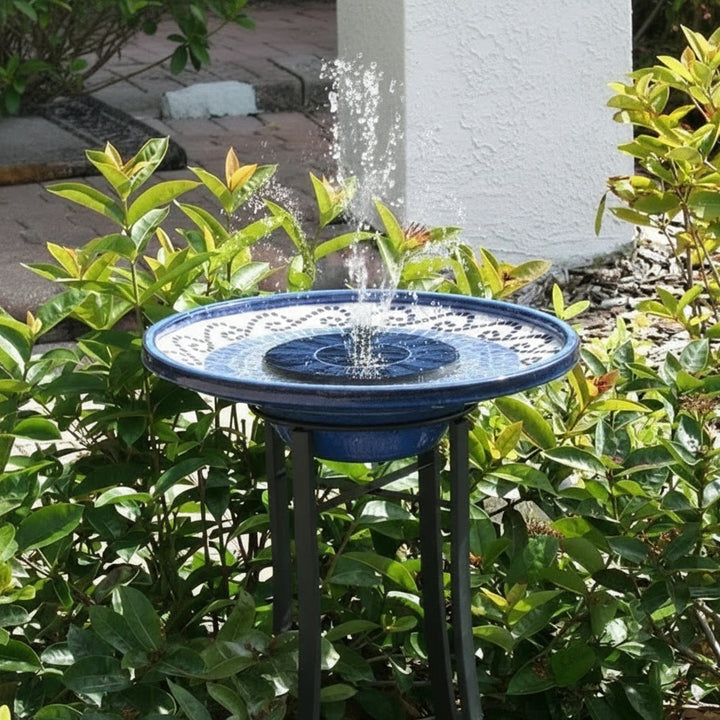 Beautiful floating solar fountain pump creating a serene water feature in a garden pond or birdbath, solar-powered.