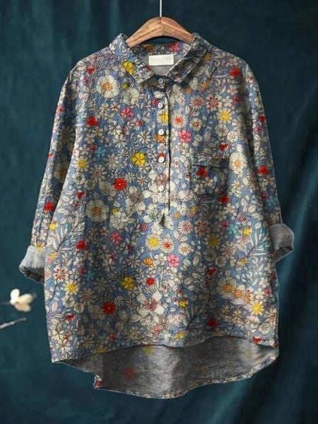 Model wearing versatile floral long sleeve blouse. Effortless elegant women's top, perfect for chic style.