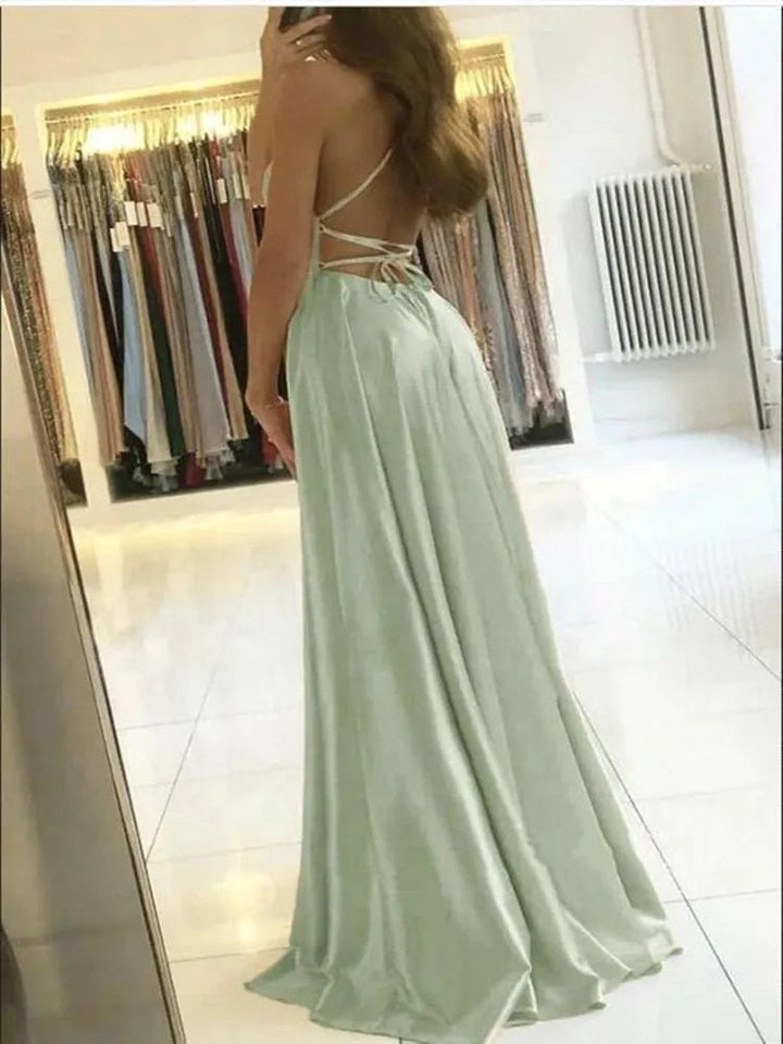 Elegant women's flowing maxi dress with a chic side slit, perfect for evening wear or summer parties.