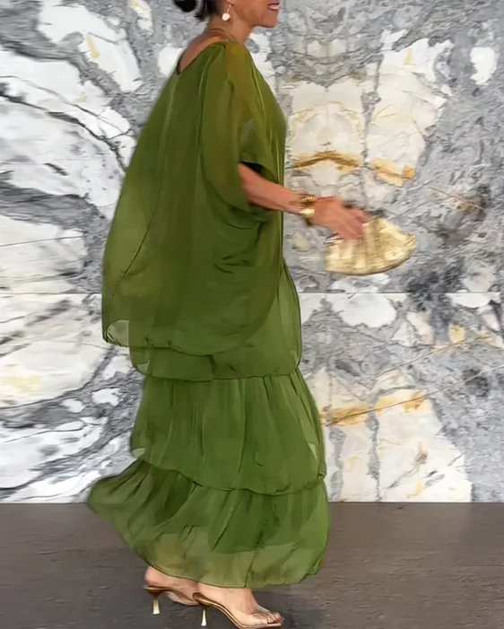 Graceful women's flowing long sleeve tiered maxi dress, designed for a relaxed fit and beautiful movement.