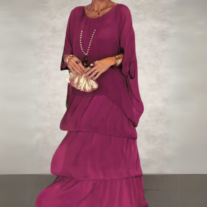 Relaxed fit women's long sleeve tiered maxi dress, featuring a beautiful print and flowy, elegant design.