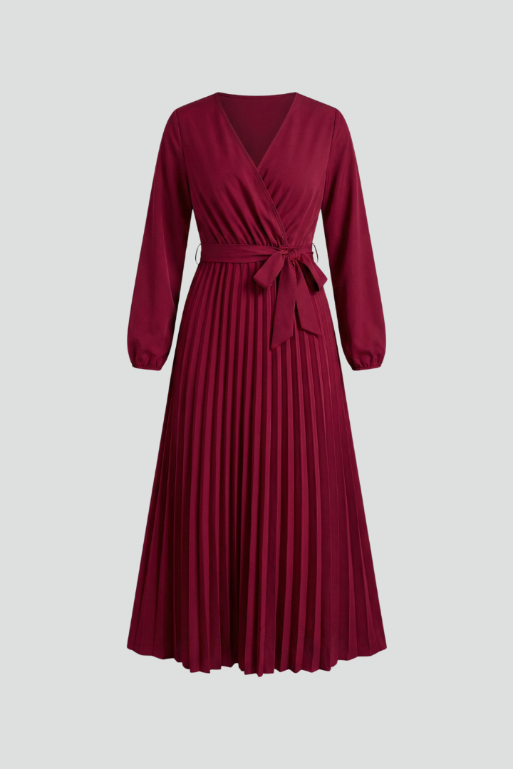 Full shot of an elegant women's V-neck maxi dress with a flowing pleated skirt & chic tie waist.