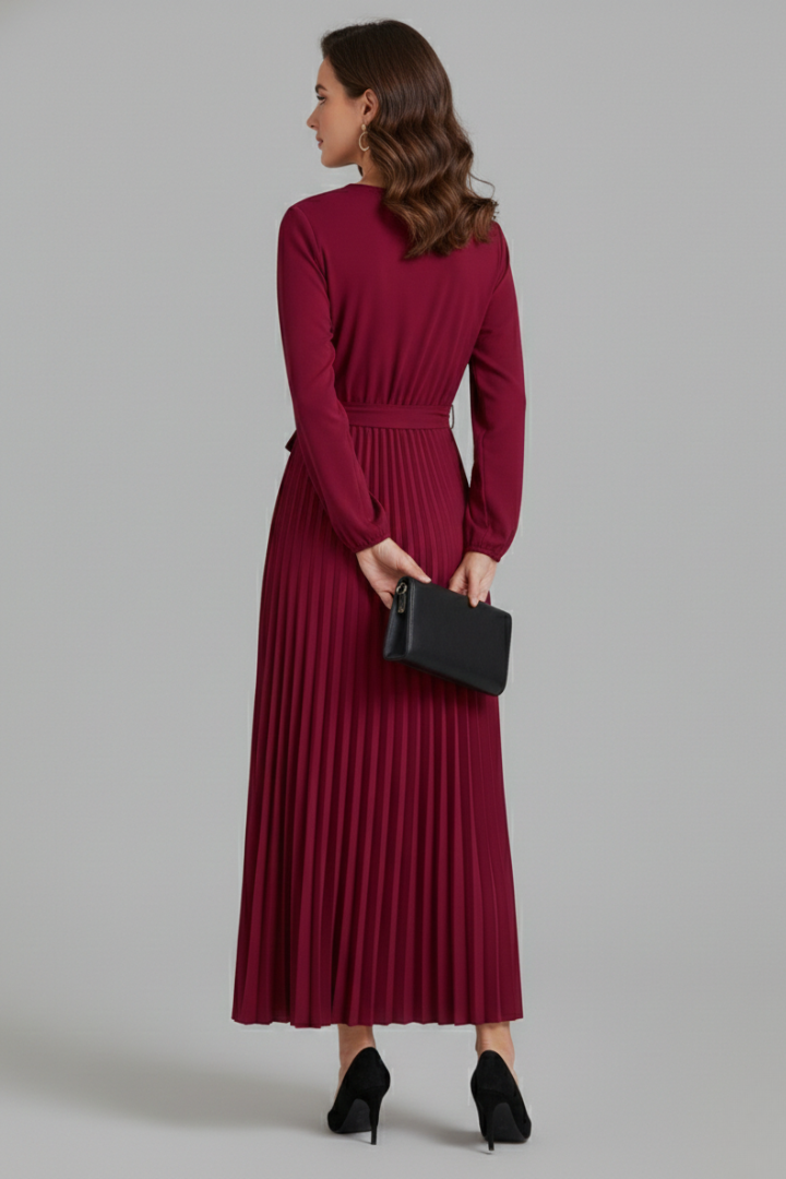 Stunning women's V-neck maxi dress, designed for elegance, with a pleated skirt and a stylish tie waist detail.