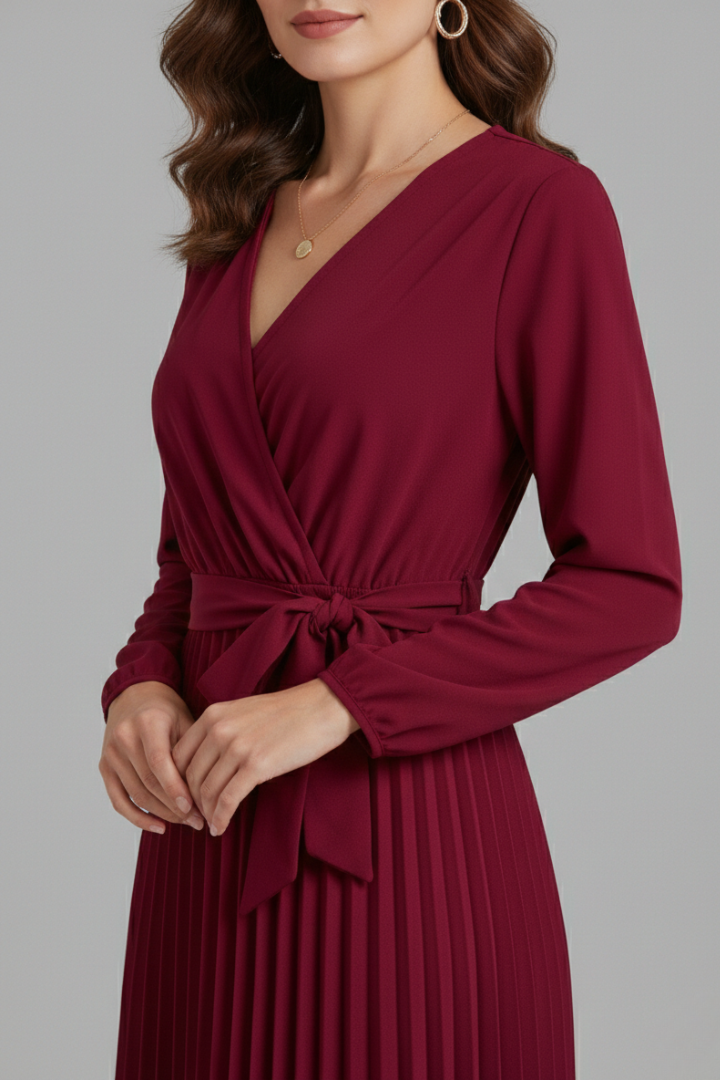 Women's long elegant V-neck maxi dress with a beautiful pleated skirt and a flattering tie waist detail.