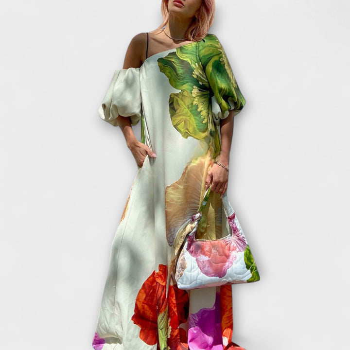 Green floral maxi dress for women with elegant asymmetrical neckline & flowy skirt.
