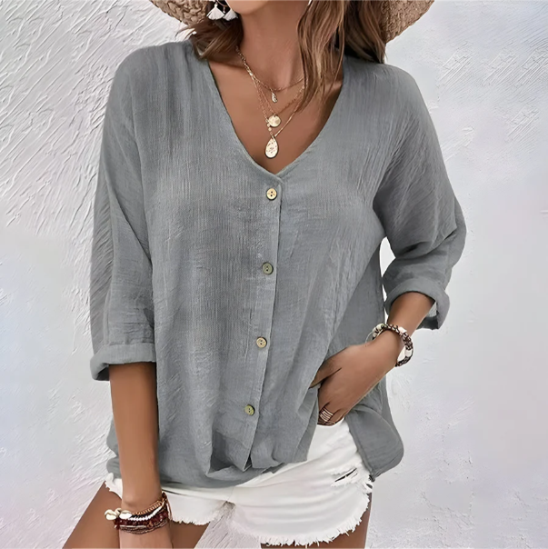 Gray relaxed fit V-neck blouse for women. Versatile button-up, chic elbow sleeve top for everyday.