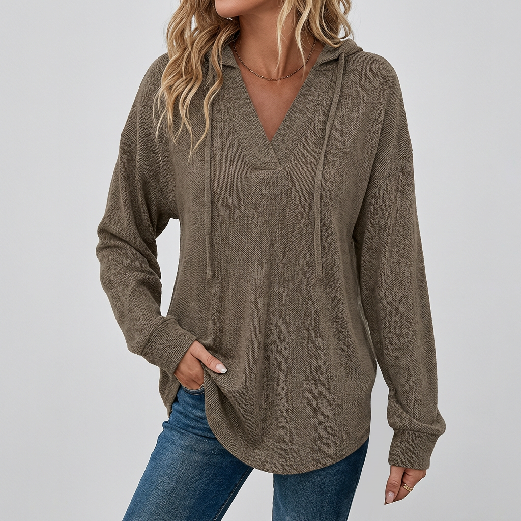 Trendy women's oversized V-neck hoodie, an essential casual top for modern everyday fashion.