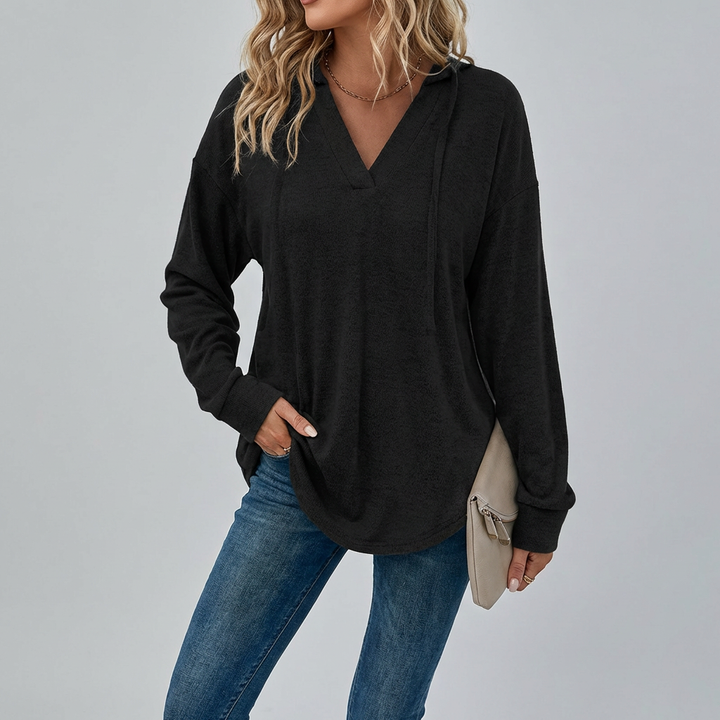 Versatile women's V-neck oversized hoodie, a trendy long-sleeve top perfect for fall layering.