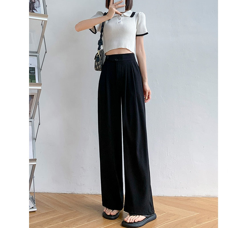 Flowing high-waist wide leg trousers for women, providing a comfortable and flattering fit.