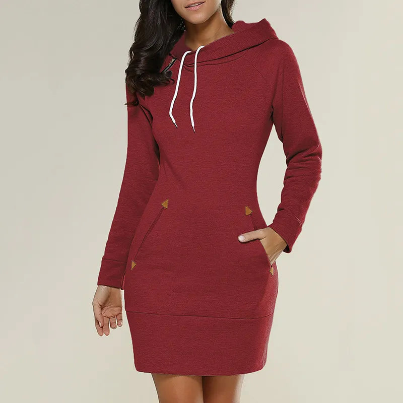 Model wearing women's hooded sweatshirt dress, relaxed fit & useful pockets for comfort.