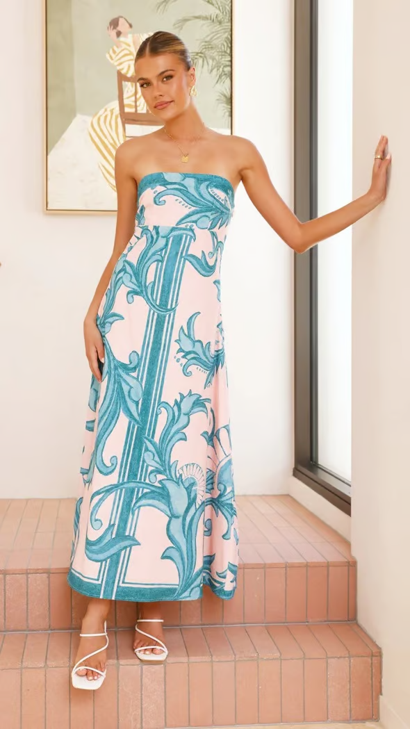 Stylish women's printed midi dress featuring a flowy silhouette & short sleeves for elegant summer fashion.
