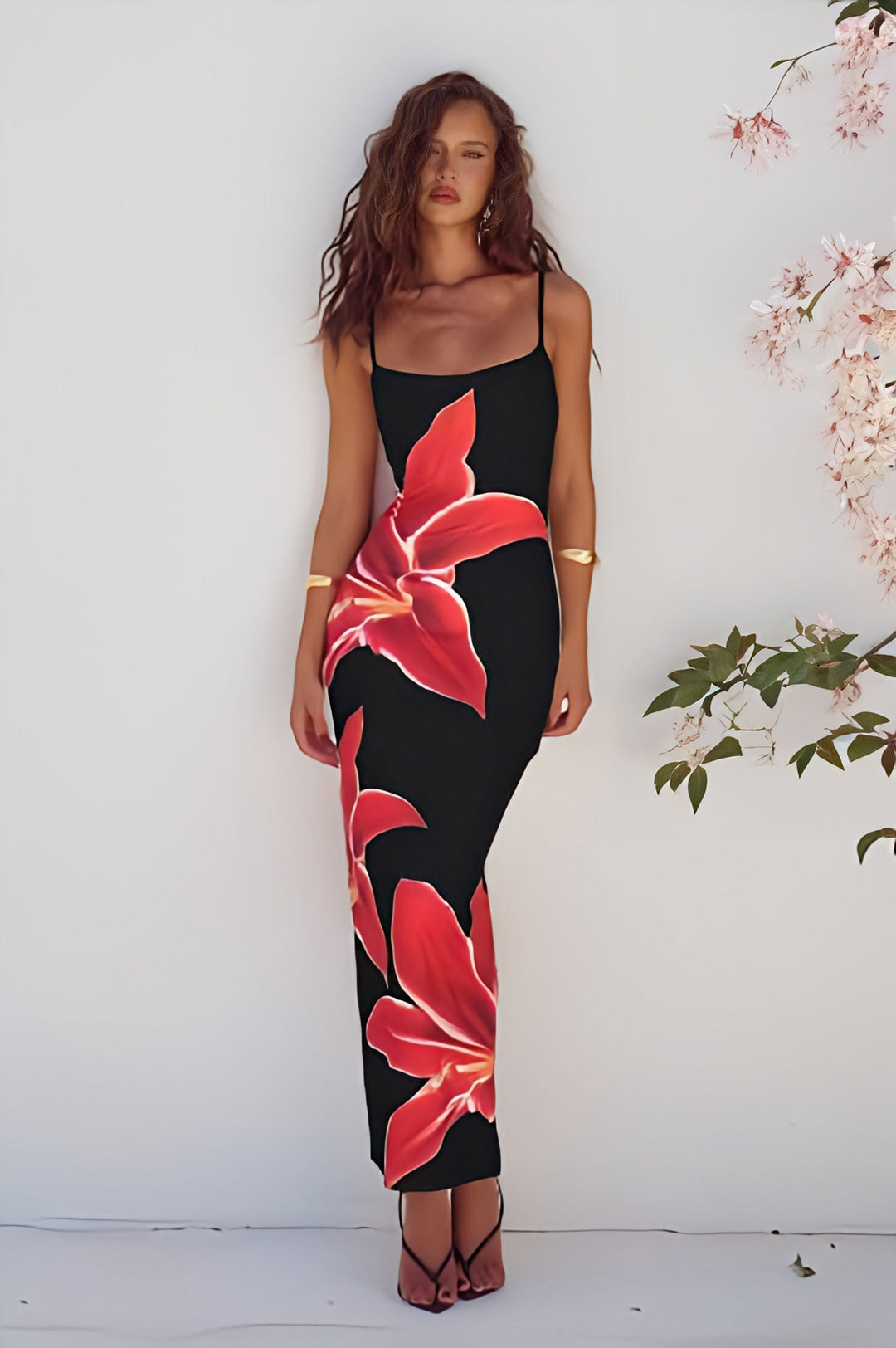 Elegant black floral maxi dress for women, perfect for summer beach style or casual flowy wear.