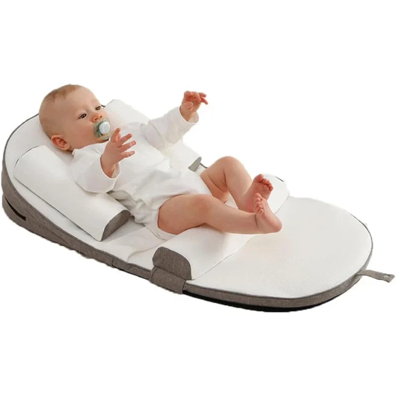 Cozy infant side sleeper pillow for newborn comfort. Secure support helps baby sleep soundly & peacefully.
