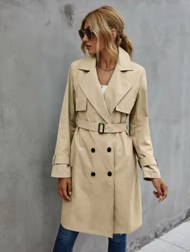 Elegant green belted trench coat for women, double-breasted front, a classic piece for any wardrobe