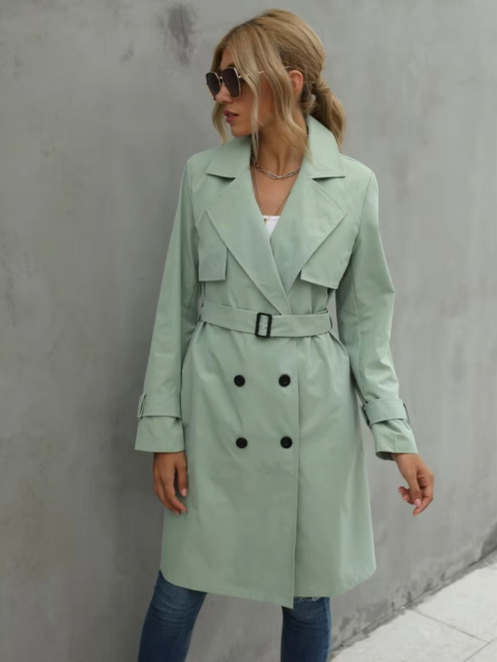 Stylish women's double-breasted trench coat in khaki with belt, ideal for sophisticated fall outerwear