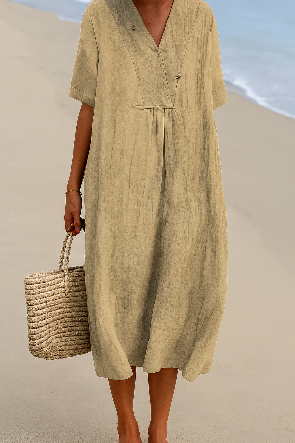 Pink women's relaxed V-neck beach dress with short sleeves. A stylish, flowy summer vacation essential.